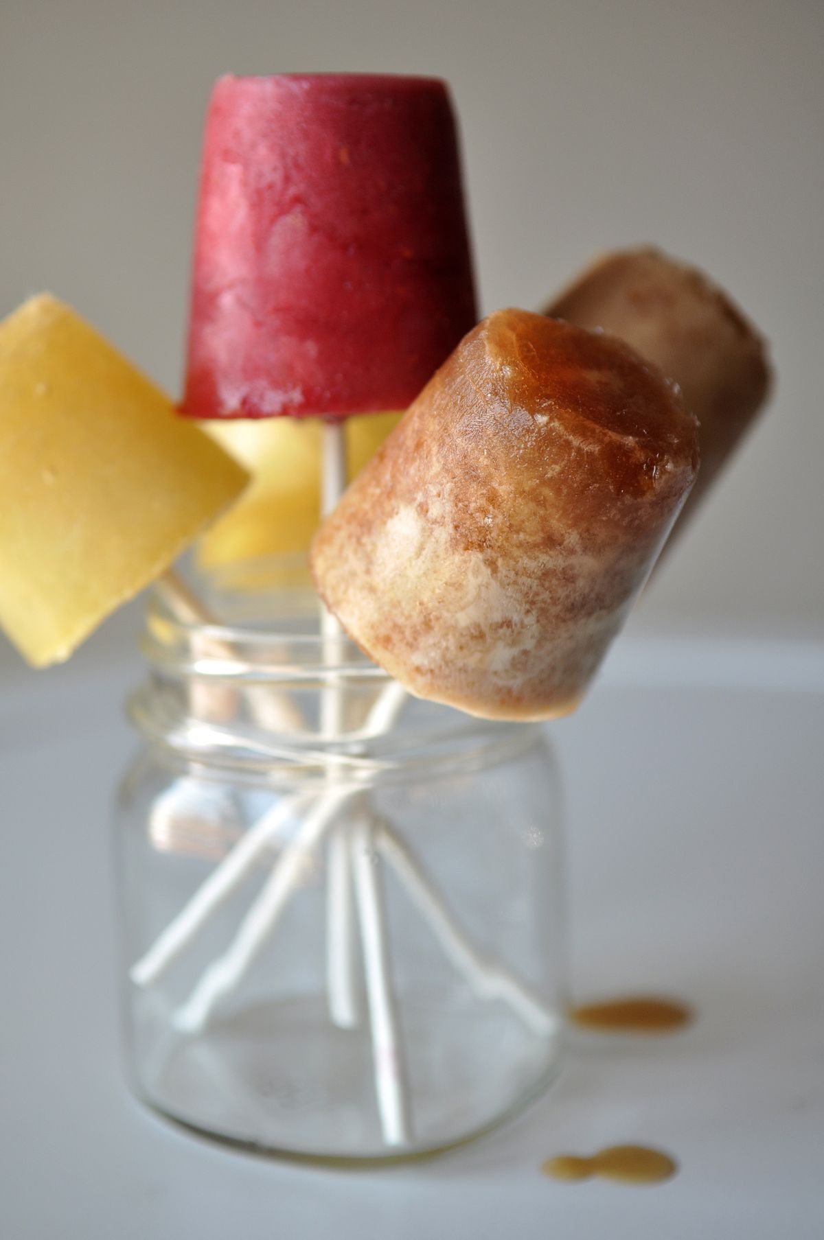 Pictured at left: Beat the heat with multi-flavored beer-sicles, or ice pops for grown-ups. From left, there’s lime-lager, raspberry lambic and cherry lambic, all with fresh fruit as well as beer. (Adriana Janovich)