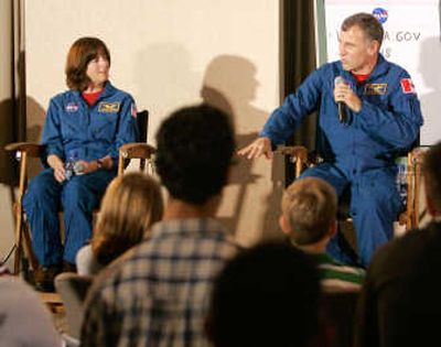 
Barbara Morgan and Canadian Space Agency Astronaut Dave Williams answer students' questions  at Epcot Center.
 (The Spokesman-Review)