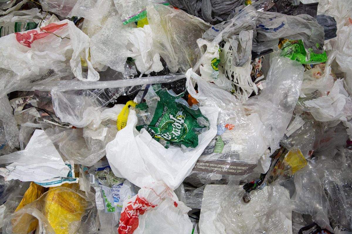 Soft plastics are non-recyclable but ended up in this bale of recyclables, which was handsorted to filter out the non-recyclables from the paper at Inland Empire Paper in July. (Libby Kamrowski / The Spokesman-Review)