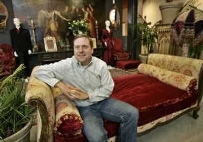 
Darren Julien, president of Julien's Auctions, sits on an Empire-style sofa among hundreds of items from the homes of Sharon and Ozzy Osbourne in Malibu and Beverly Hills, Calif., and Buckinghamshire, England, on display at Gibson Guitar Center in Beverly Hills.  More than 500 lots of memorabilia, jewelry, costumes, paintings, furniture and artworks were being auctioned Friday and today.Associated Press photos
 (Associated Press photos / The Spokesman-Review)