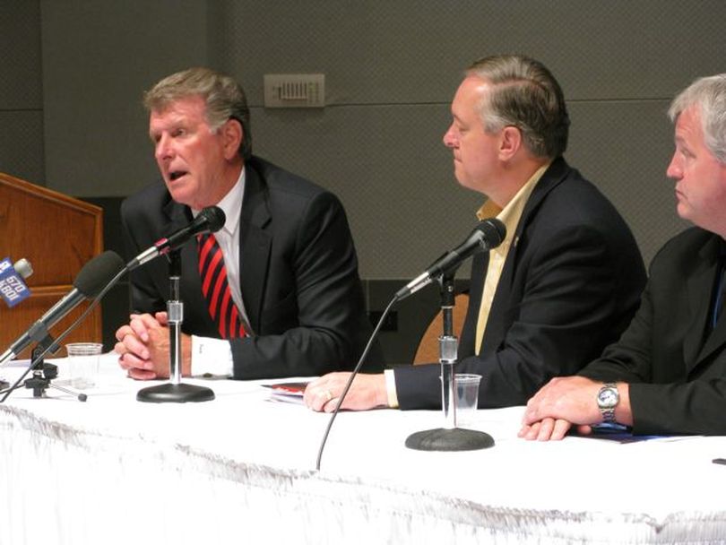 Idaho Gov. Butch Otter announces a new institute to train lawmakers from the United States and Canada on energy issues, sponsored by the Pacific Northwest Economic Region group, which is meeting this week in Boise. At center is University of Idaho President Duane Nellis; at right is Washington House Speaker Pro-Tem Jeff Morris, D-Mt. Vernon, (Betsy Russell / The Spokesman-Review)