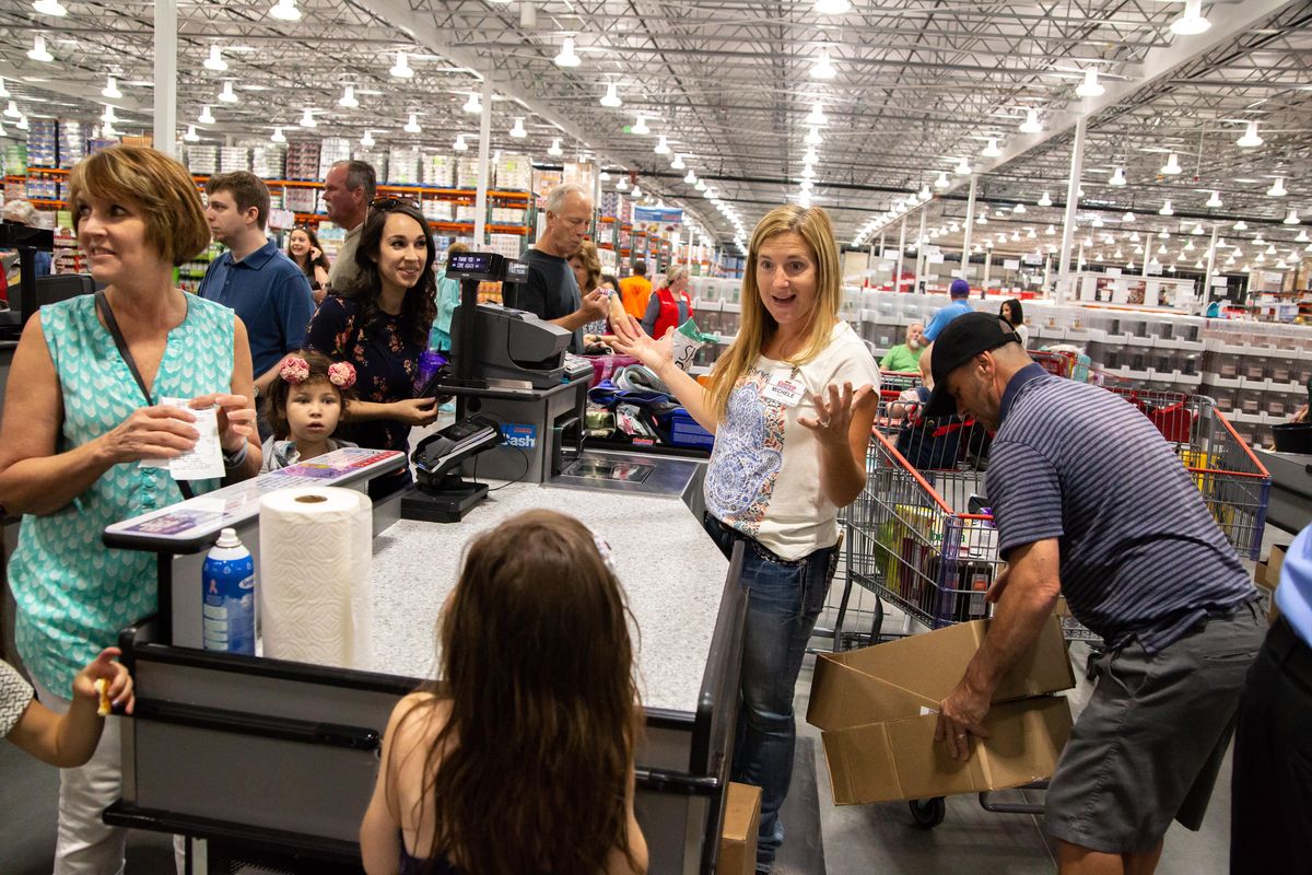 Checker Michele Lamanna tells a young customer happy birthday while engaging in friendly conversation on July 20, 2018 during the opening day of the north Spokane Costco on July 20, 2018. The 134,000 square foot retail store replaces the former North Division Costco, and is now open at 12020 N. Newport Highway. (Libby Kamrowski / The Spokesman-Review)