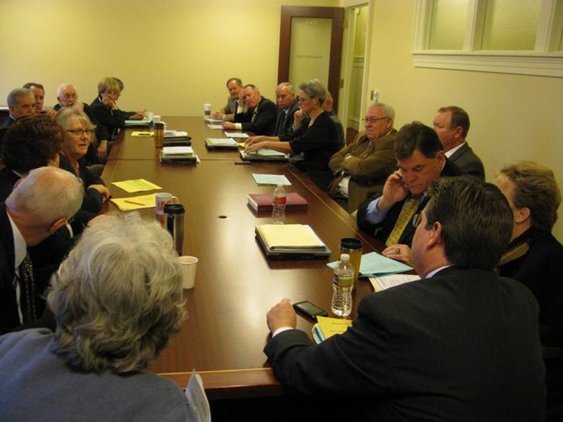 Members of the Joint Finance-Appropriations Committee discuss scheduled issues around next week's GOP presidential caucuses at their early-morning work session on Thursday. (Betsy Russell)