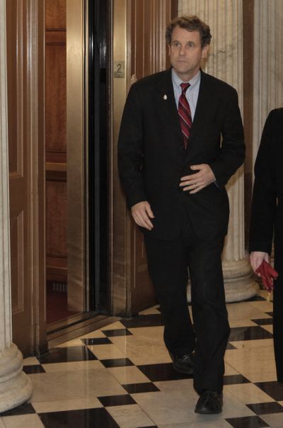 Sen. Sherrod Brown arrives on Capitol Hill from his mother’s wake in Ohio to cast the final vote to pass  the stimulus bill Friday.  (Associated Press / The Spokesman-Review)