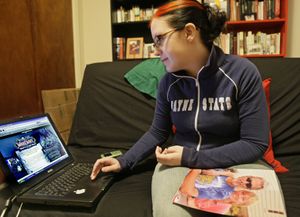 Melissa Spangenberg looks at a “World of Warcraft” Web page in New York on Feb. 1.  (Associated Press / The Spokesman-Review)