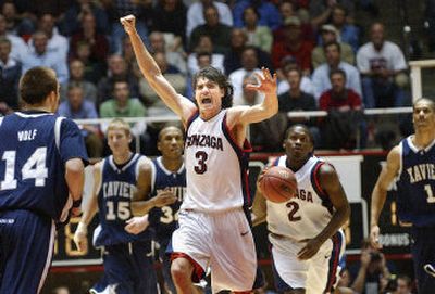  Adam Morrison, celebrating a defensive stand, leads the charge in Thursday night's first-round victory over the Musketeers. Morrison scored 35 points and also led the team in assists with four.
 (The Spokesman-Review)