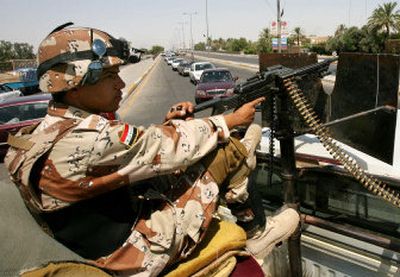 
An Iraqi soldier mans a checkpoint stopping all vehicle traffic on a bridge in central Baghdad. Iraqi authorities have initiated a four-hour driving ban on Fridays, from 11 a.m. to 3 p.m.
 (Associated Press / The Spokesman-Review)