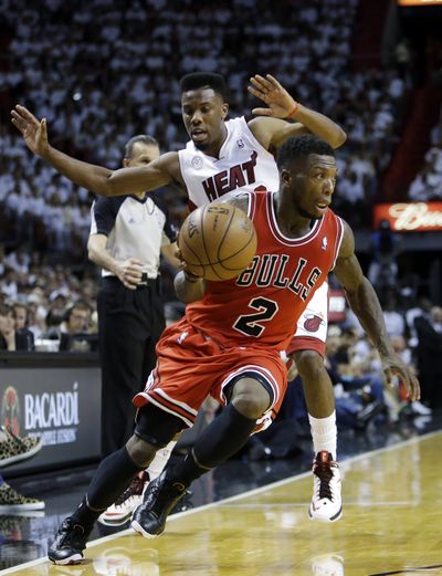 Nate Robinson’s gritty play led the Bulls past Norris Cole and the Heat in Game 1. (Associated Press)
