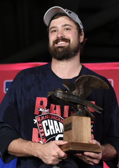 Cleveland Indians relief pitcher Andrew Miller accepts the MVP trophy for the series after the Indians defeated the Toronto Blue Jays 3-0 in Game 5 of the baseball ALCS. (Nathan Denette / Associated Press)