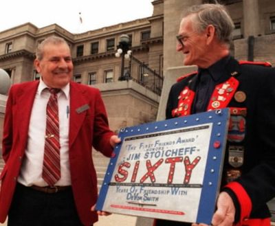 In this 1995 SR file photo, North Idaho representative Jim Stoicheff, in front of the capitol building, gets a homemade plaque from childhood friend DeVon Smith to commemmorate 60 years of friendship. Smith made the plaque from recycled scrap metal. (File photo by Joe Relk)  
