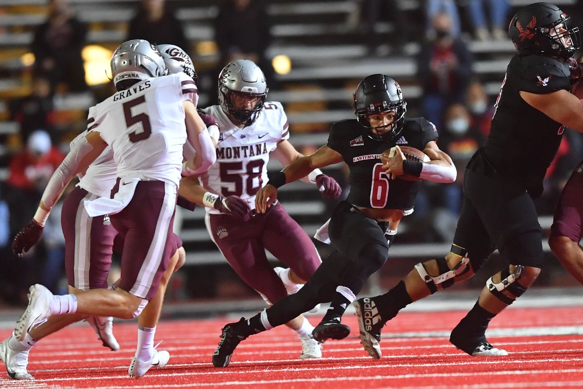 Eastern Washington Eagles running back Dennis Merritt (6) runs the ball against Montana Grizzlies linebacker Patrick O’Connell (58) during the first half on Saturday, at Roos Field in Cheney.  (Tyler Tjomsland/The Spokesman-Review)