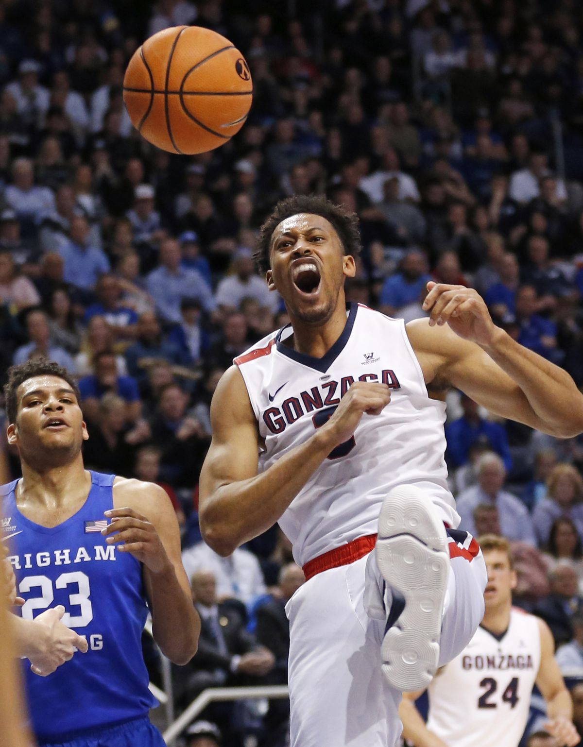 Gonzaga forward Johnathan Williams, right, reacts after dunking while BYU forward Yoeli Childs (23) watches during the first half of an NCAA college basketball game Saturday, Feb. 24, 2018, in Provo, Utah. (AP Photo/Rick Bowmer) ORG XMIT: UTRB112 (Rick Bowmer / Associated Press)