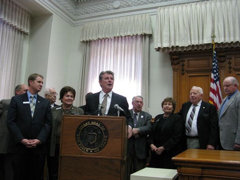 Gov. Butch Otter joins with lawmakers at a press conference at the close of the legislative session on Friday afternoon. (Betsy Russell / The Spokesman-Review)