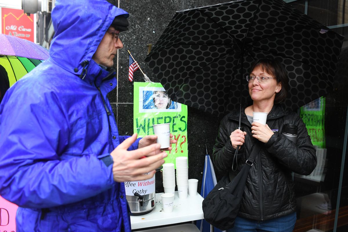 A group of protesters, including David Jones, left, and Diane Belyea, right, stand in the rain outside Cathy McMorris Rodgers office building to make a point that the congresswoman has not been meeting regularly with constituents in town hall settings. While the protesters were out Monday, Feb. 20, 2017, McMorris Rodgers was in a small group meeting in a nearby building. Jesse Tinsley/THE SPOKESMAN-REVIEW (Jesse Tinsley / The Spokesman-Review)