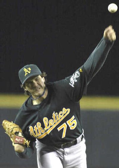 
Oakland pitcher Barry Zito delivers a strike in the second inning Saturday. 
 (Associated Press / The Spokesman-Review)