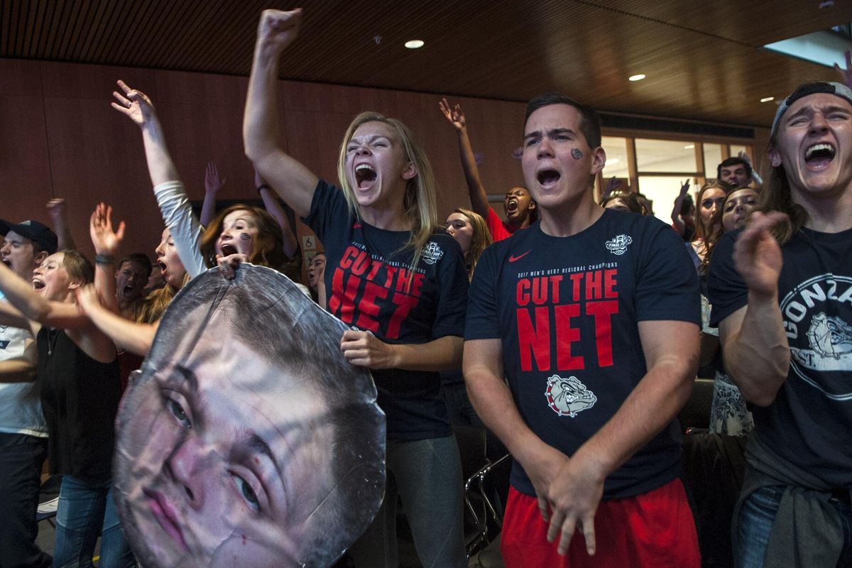 Gonzaga fans Bailey Luoma, left and Alli Steinbeck hold the cut-out Przemek Karnowski as they cheer on the team at the GU