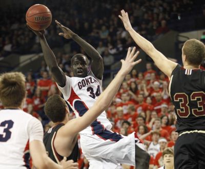 Gonzaga's Bol Kong looks to pass to Kelly Olynyk, left, against Santa Clara's Marc Trasolini, center, and Phillip Bach, during the second half of their NCAA college basketball game at the McCarthey Athletic Center in Spokane, Wash. Thursday, Feb. 25, 2010.  Gonzaga beat Santa Clara 88-51. (Rajah Bose / Fr120940 Ap)