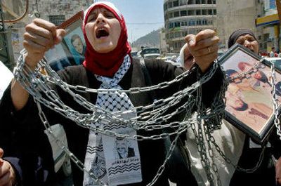 
Relatives of Palestinian prisoners demand their release from Israeli jails in the West Bank town of Nablus on Saturday. U.S. Secretary of State Condoleezza Rice met with Palestinian officials Saturday. 
 (Associated Press / The Spokesman-Review)