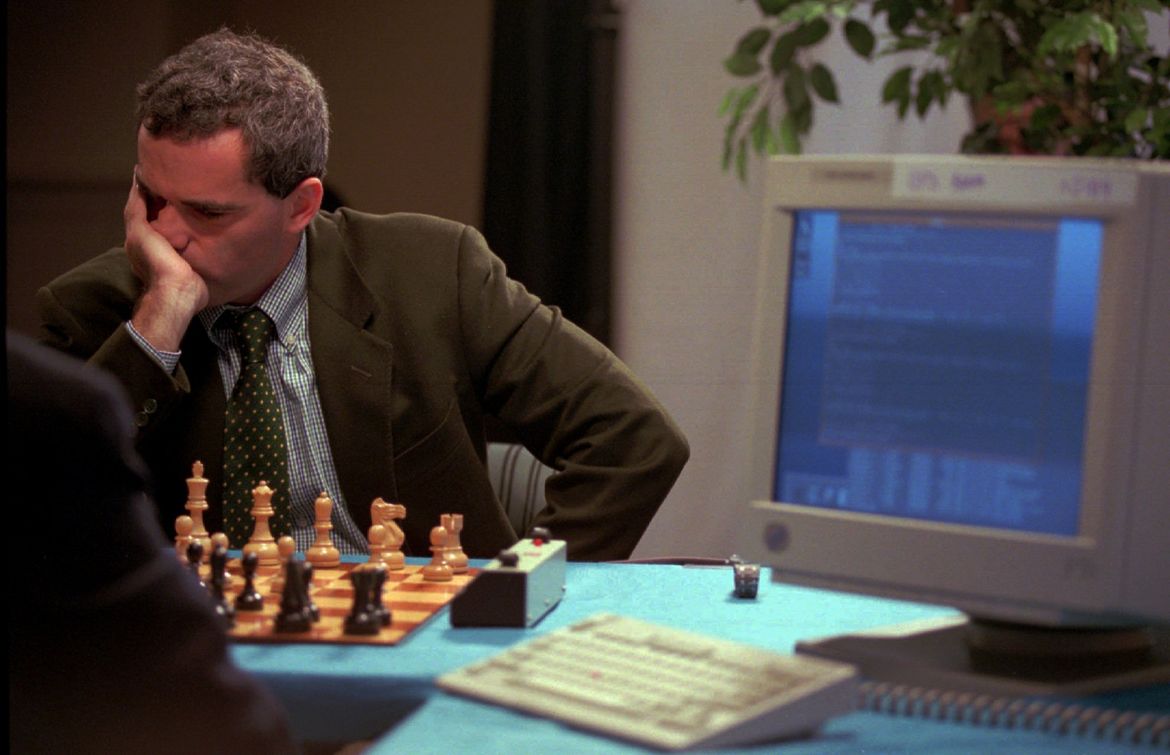 World chess champion Garry Kasparov walks around the playing room as he  waits for IBM's Deep Blue chess playing computer to make its next move  during the third game of their six