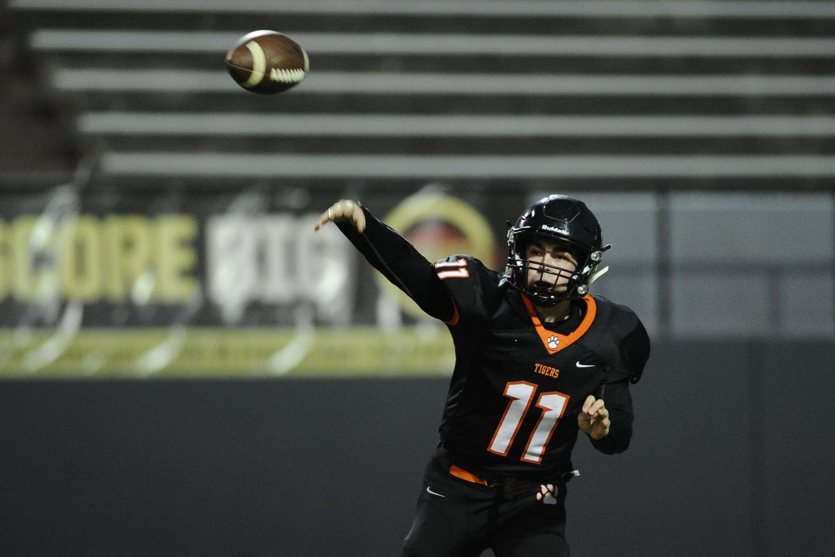 Lewis and Clark quarter back Michael Flaherty (11) throws a pass against the Central Valley during a high school football game, Friday, Oct. 27, 2017, at Albi Stadium. (James Snook / For The Spokesman-Review)