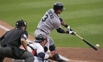 Ronny Cedeno hits a run-scoring single for the Mariners in the fourth inning of Friday’s win at Cleveland.  (Associated Press / The Spokesman-Review)