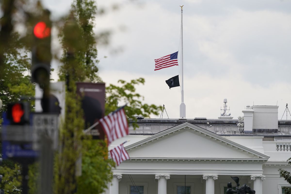 The American flag flies at half-staff over the White House in Washington, Friday, April 16, 2021.  (Susan Walsh)