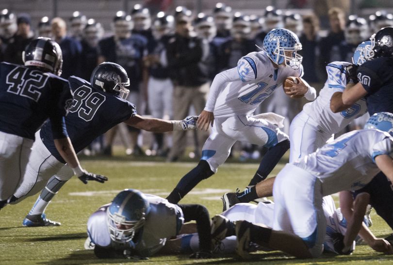 Central Valley quarterback Adam Chamberlain is detained by Gonzaga Prep's Evan Weaver (89) in the backfield Friday, Nov. 1, 2013 at Gonzaga Preparatory School. (Jesse Tinsley / The Spokesman-Review)