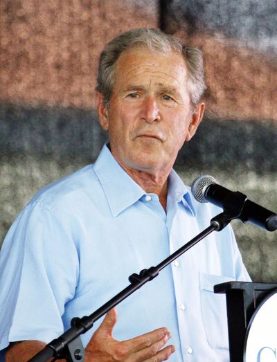 Former President George W. Bush salutes first responders to the Mississippi Gulf Coast. (Associated Press)
