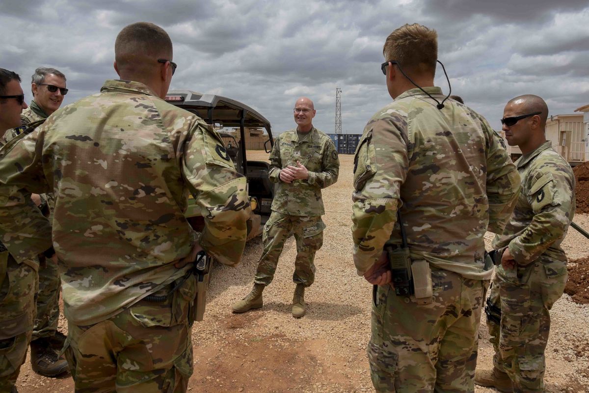 U.S. Army Brig. Gen. Damian T. Donahoe, deputy commanding general, Combined Joint Task Force - Horn of Africa, center, talks with service members during a battlefield circulation Saturday, Sept. 5, 2020, in Somalia. No country has been involved in Somalia