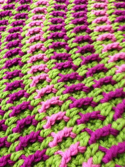 Edie Eckman shows a rail stitch in lime green, pink and fuschia. (Associated Press)