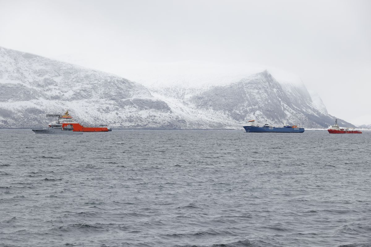 The Dutch cargo ship Eemslift Hendrika, second from right, is guided to land at Alesund, Norway, Thursday, April 8, 2021. Despite heavy seas, a joint Norwegian-Dutch salvage operation has managed to get the abandoned Dutch cargo ship under control off the coast of Norway and towing it to port.  (Associated Press)