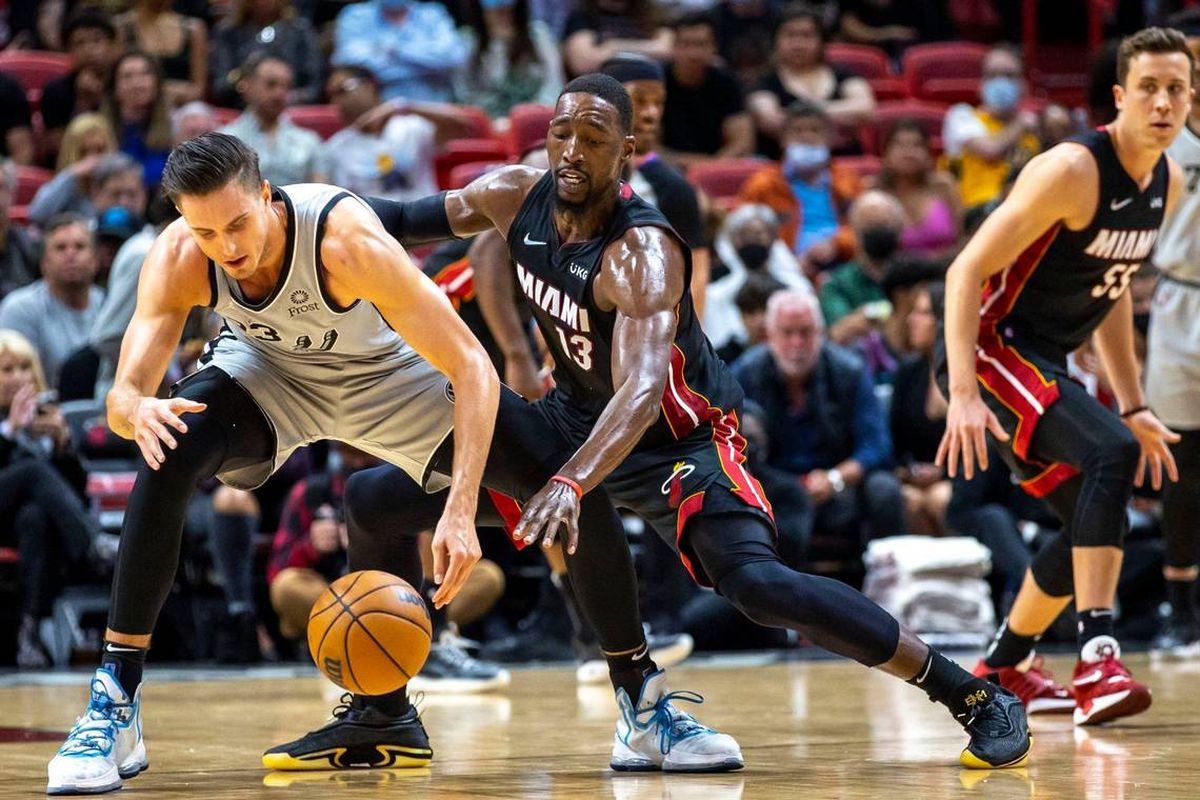 Miami Heat center Bam Adebayo defends San Antonio Spurs forward Zach Collins during the first quarter of an NBA game Feb. 26, 2022, at FTX Arena in Miami.  (Daniel A. Varela)
