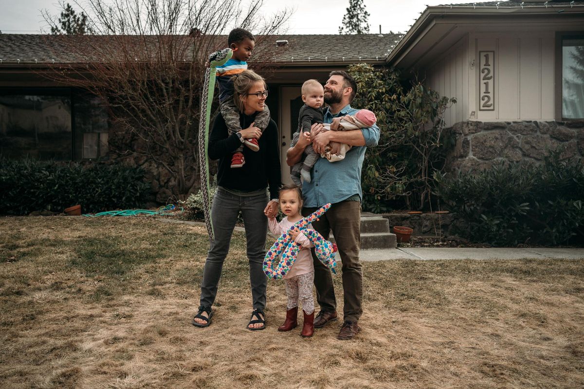 The Ellis family – Erika with Kai on her shoulders, Evie and Scott holding Arlo and Ada – at home on March 1, the day after Ada was born in Spokane. (margaret albaugh)