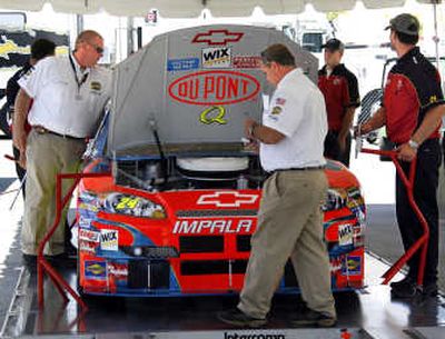 
Jeff Gordon's No. 24 Chevrolet, being looked at here by NASCAR officials, failed inspection before practice. Associated Press
 (Associated Press / The Spokesman-Review)