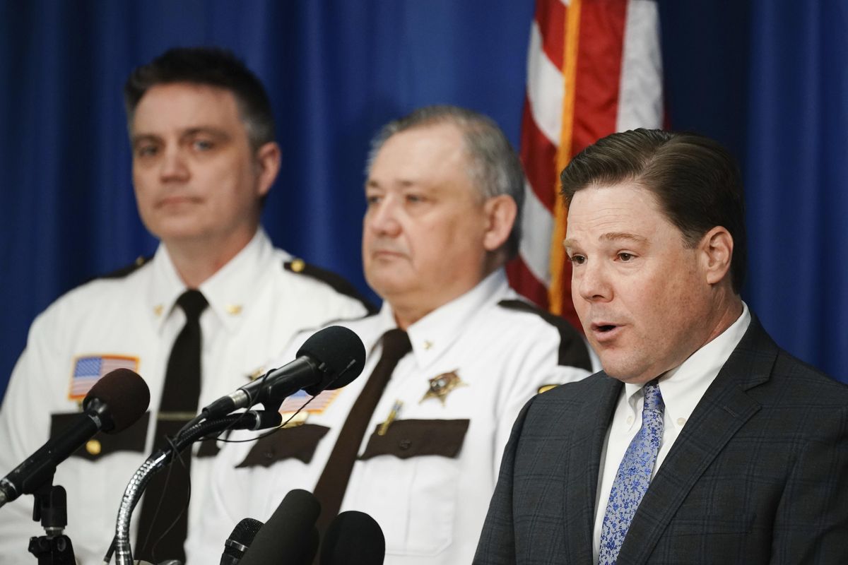 Carver County Attorney Mark Metz, right, announces at a press conference Thursday in Chaska, Minn., that no criminal charges will be filed in the death of musician Prince in 2016. The decision effectively ends the state
