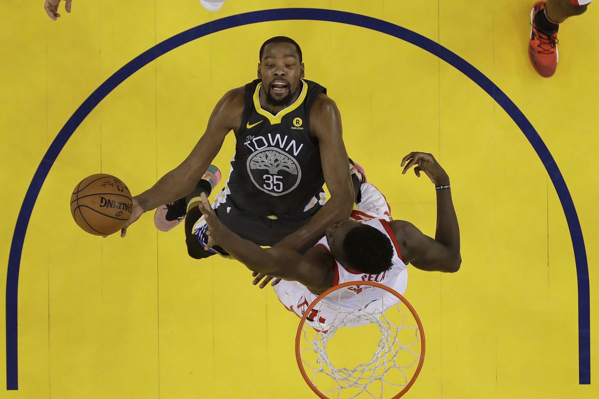 Golden State Warriors forward Kevin Durant (35) shoots against Houston Rockets center Clint Capela during the first half of Game 4 of the NBA basketball Western Conference Finals in Oakland, Calif., Tuesday, May 22, 2018. (Marcio Jose Sanchez / Associated Press)