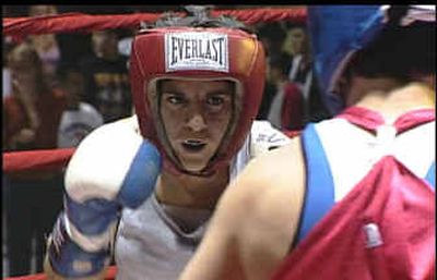 
Boxer Becky Zerlentes, left, is shown during her bout with Heather Schmitz on Saturday. Zerlentes died Sunday afternoon. 
 (Associated Press / The Spokesman-Review)