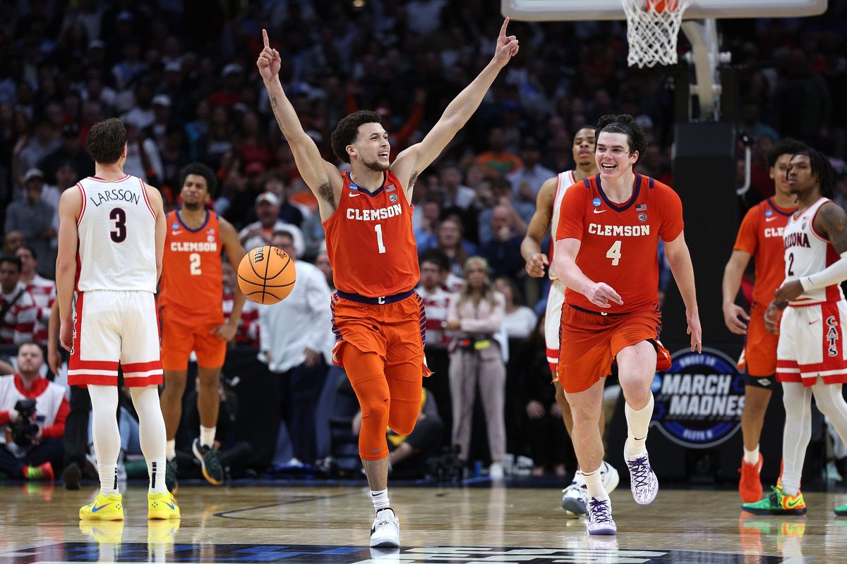 Clemson’s Chase Hunter (1) celebrates with his teammate Ian Schieffelin (4) after time expires in a 77-72 win against Arizona in the Sweet 16 round of the NCAA Tournament at Crypto.com Arena on Thursday, March 28, 2024, in Los Angeles.  (Tribune News Service)