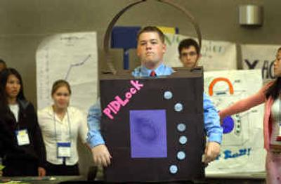 
Jake Bell of Timberline High School wears an ad for his product in a bid to score investors for his team at the Business Week 2004 Trade Show at Gonzaga University. 
 (Christopher Anderson/ / The Spokesman-Review)