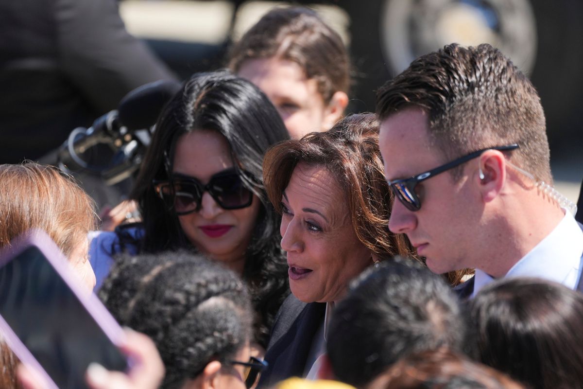 Vice President Kamala Harris greets a crowd after landing on Air Force Two in Sunnyvale, Calif., on Monday. Anticipating federal subsidies, Applied Materials said it planned to invest up to $4 billion in a semiconductor project in Sunnyvale, Calif.  (New York Times)