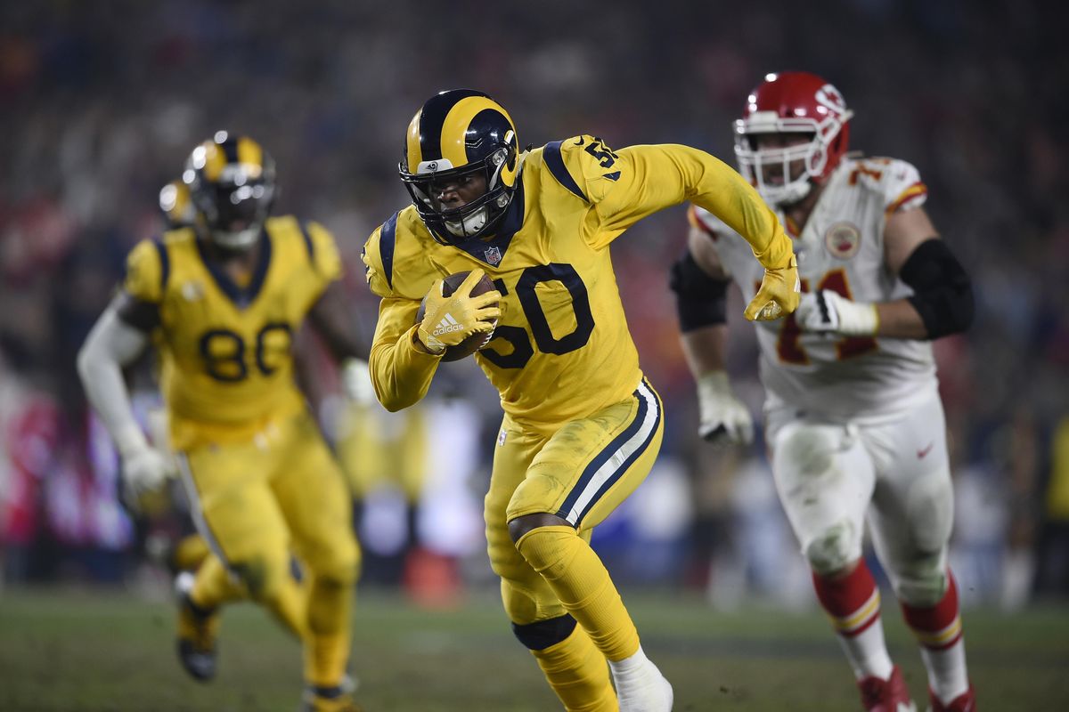 Los Angeles Rams outside linebacker Samson Ebukam runs for a touchdown after making an interception during the second half  against the Kansas City Chiefs on Monday in Los Angeles. (Kelvin Kuo / AP)