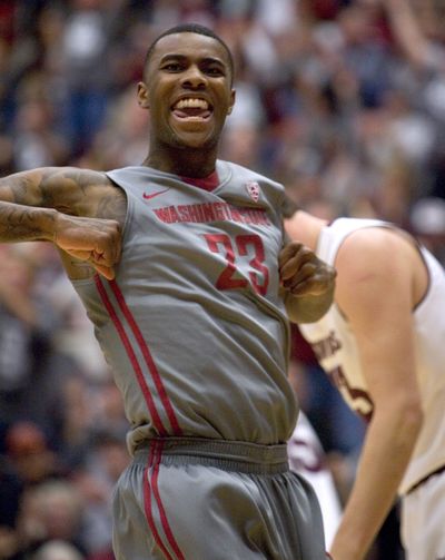 Washington State forward D.J. Shelton (23) reacts after dunking against Arizona State during the second half Saturday. Washington State won 72-50. (Associated Press)
