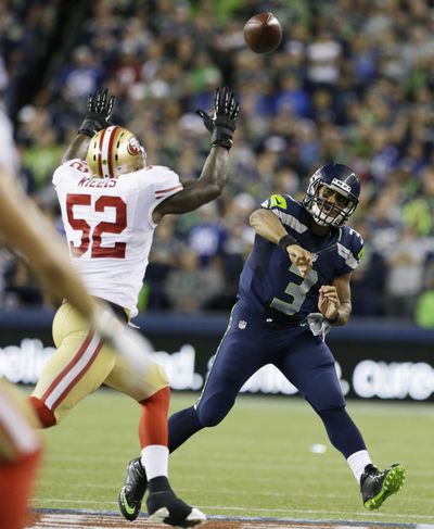 Quarterback Russell Wilson, right, and Seahawks eye first win at Candlestick since 2008 season. (Associated Press)