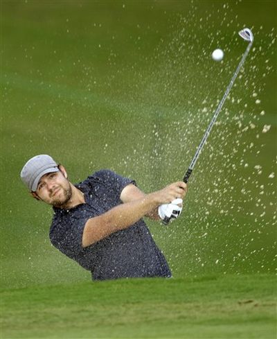 Ryan Moore hits from a sand trap on the 18th hole during the final round of the Wyndham Championship PGA golf tournament at Sedgefield Country Club in Greensboro, N.C., Sunday, Aug. 23, 2009. Moore won for the first time on the PGA Tour with a birdie on the third hole of a sudden death playoff to beat Kevin Stadler. 

 (Chuck Burton / AP Photo)