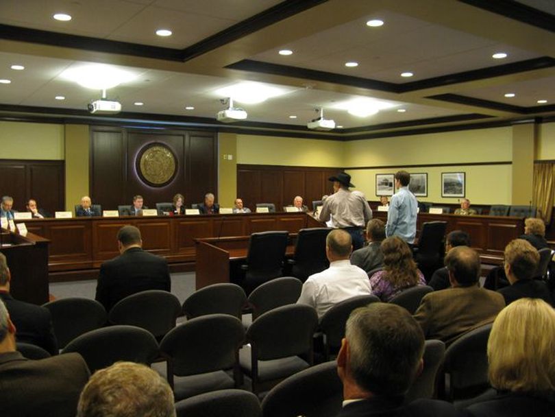 Ray Breckenridge of Tetonia, in black cowboy hat, and his son Kort address the House State Affairs Committee on Thursday, urging support for legislation to protect student athletes from repeat concussions. The committee voted to delay a vote on the bill to Monday, after members raised questions about some of its details. (Betsy Russell)