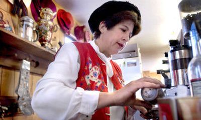 
Elaine Rising, owner of On Sacred Grounds, 12212 E. Palouse Highway, makes a beverage for a customer.
 (The Spokesman-Review)