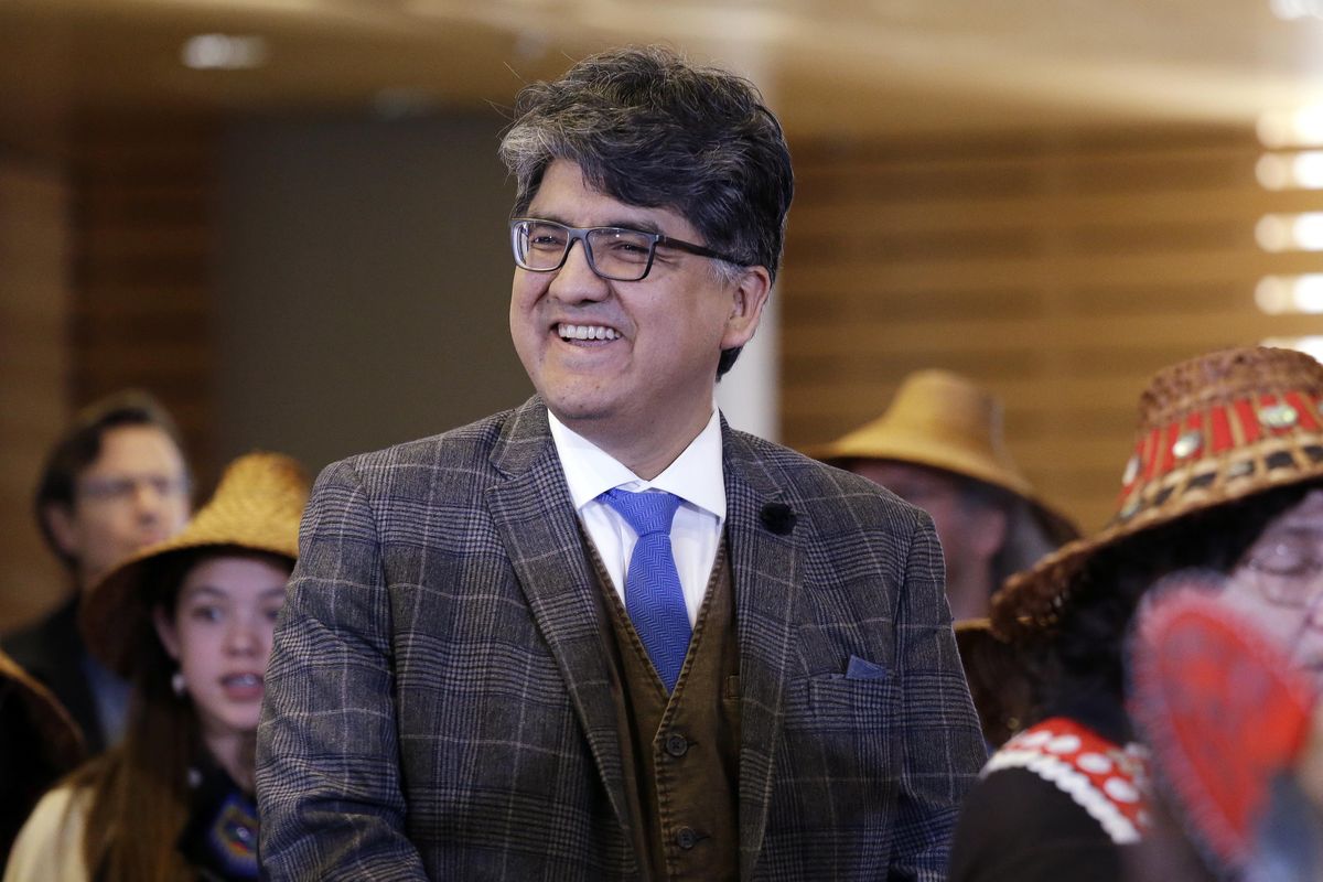 Author and filmmaker Sherman Alexie waits with dancers backstage for his turn on stage as the keynote speaker at a celebration of Indigenous Peoples Day on  Oct. 10, 2016, at Seattle’s City Hall. (Elaine Thompson / Associated Press)
