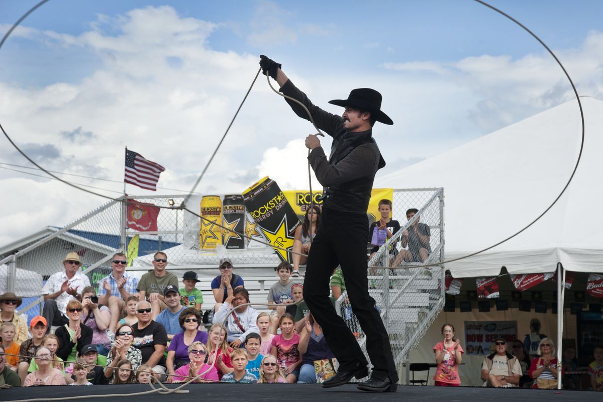 Loop Rawlins concludes his Western performance by spinning a gigantic lasso on the opening day of the North Idaho Fair & Rodeo on Wednesday at the Kootenai County Fairgrounds in Coeur d’Alene. Rawlins’ act also included gun spinning and bull-whip cracking. (Dan Pelle)