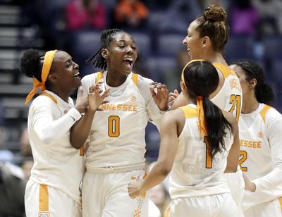 Tennessee’s Rennia Davis (0) celebrates with teammates after shooting the winning three-point basket against Auburn with one second remaining in the fourth quarter of an NCAA college basketball game at the women’s Southeastern Conference tournament Thursday, March 1, 2018, in Nashville, Tenn. (Mark Humphrey / Associated Press)
