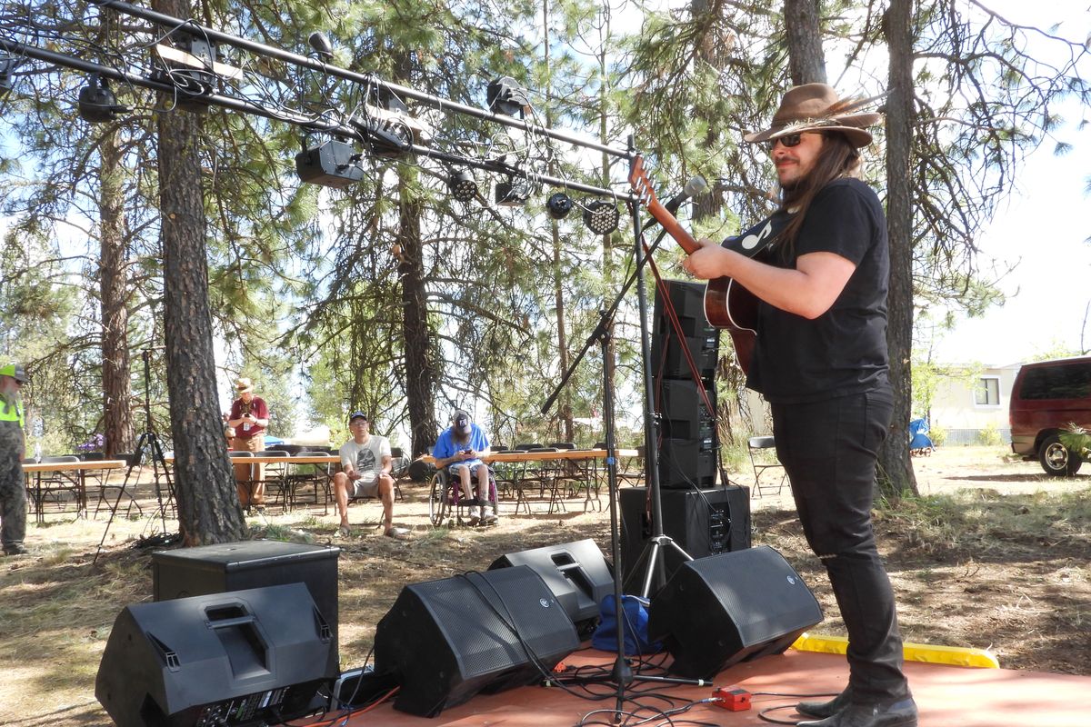 Solo artist Schuyler Dornbrier plays the first set at the SRD Music Festival at a rural home on North Indian Trail Road Friday, May 14, 2021. It was the start of the homegrown festival and people were still arriving and he played on a secondary stage while the main stage was still being set up for the weekend festival, which will serve as a fundraiser for a few different causes, including the cancer fund for Jesse Hoorelbeke, son of rock singer Peter Rivera.  (Jesse Tinsley/The Spokesman-Review)